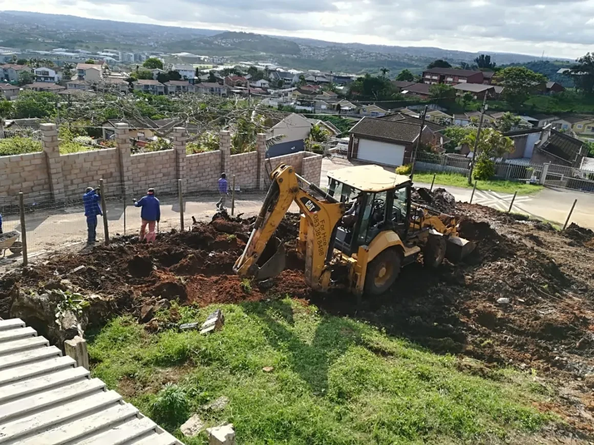 Project site — excavator digging foundations