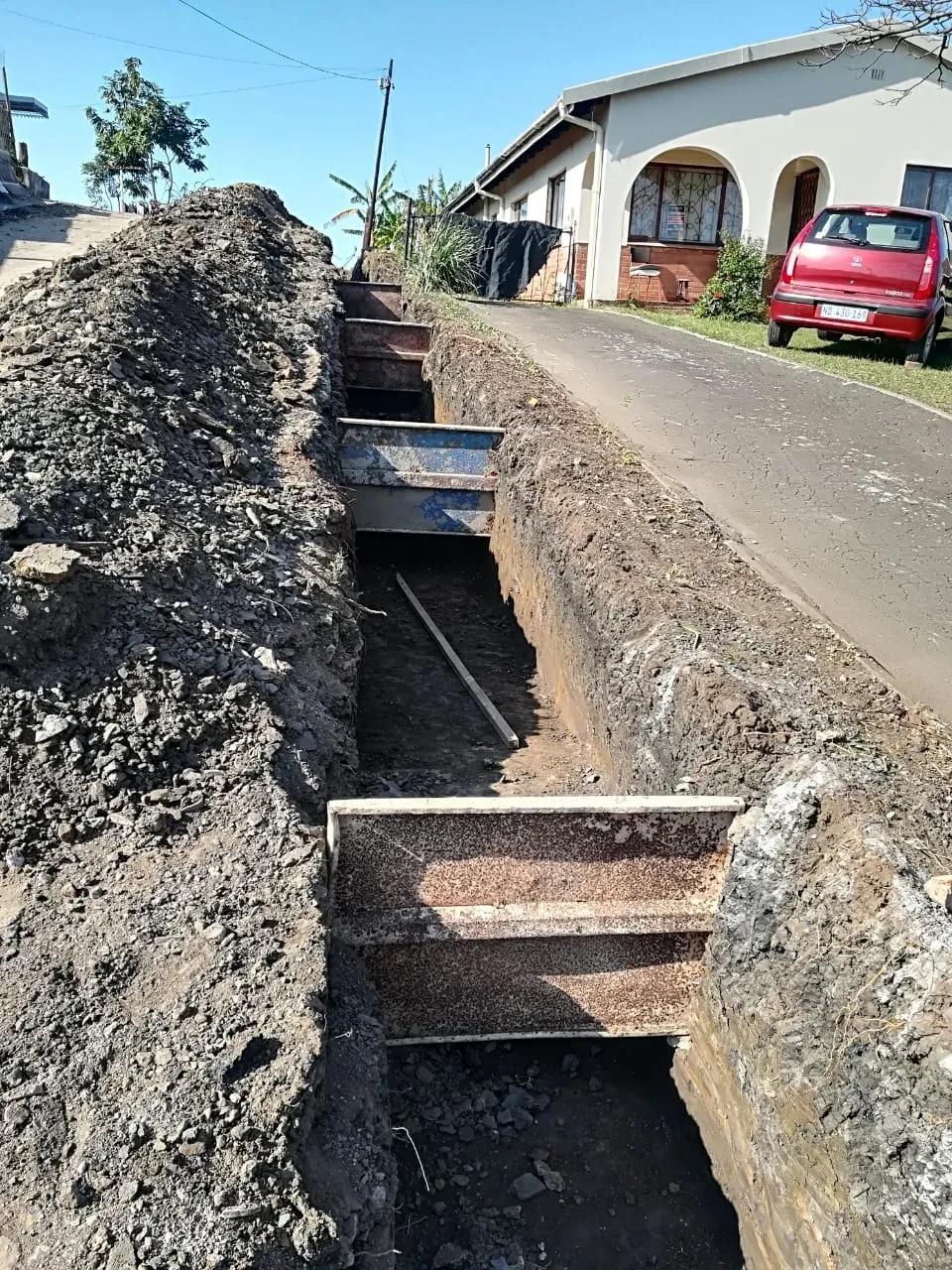 Project site — drainage trench excavation along residential street