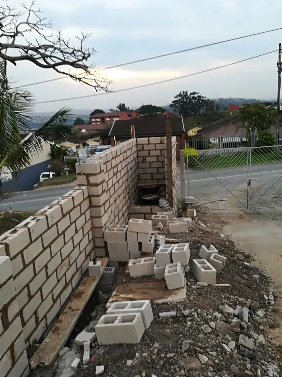 Project site — block wall and gate structure under construction
