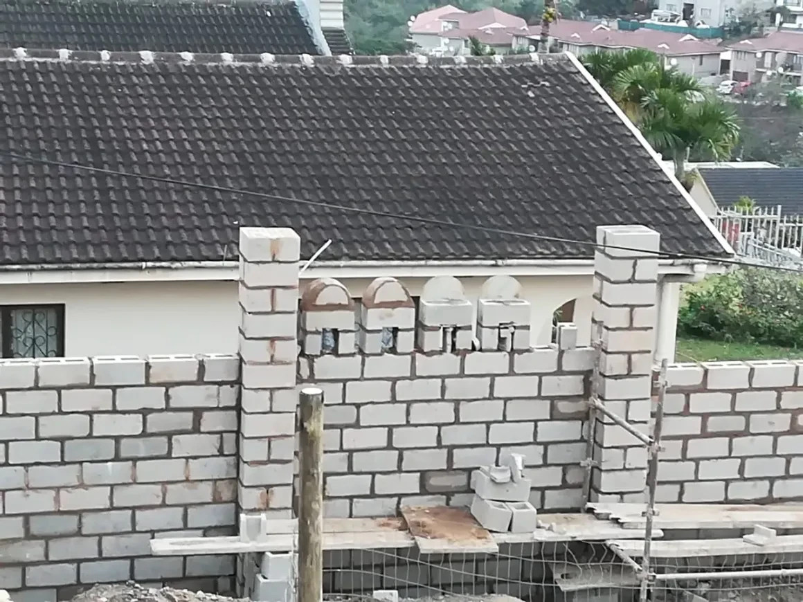 Project site — decorative brick wall with arched details