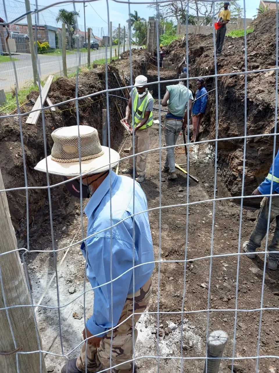 Project site — concrete block foundation wall in trench
