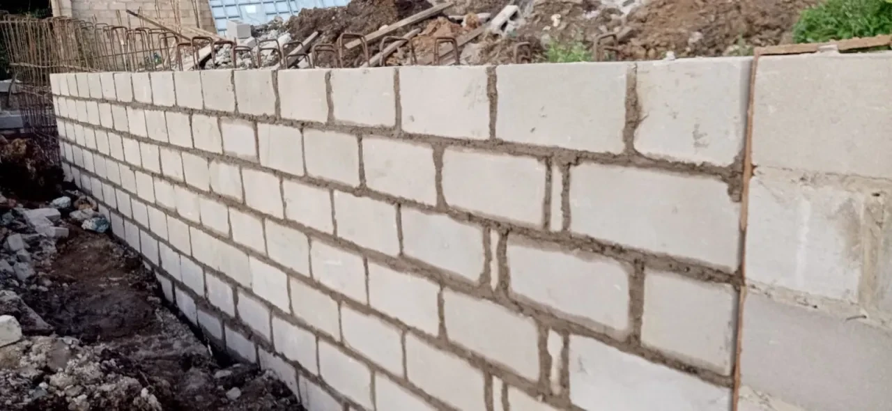 Project site — concrete brick wall under construction close-up