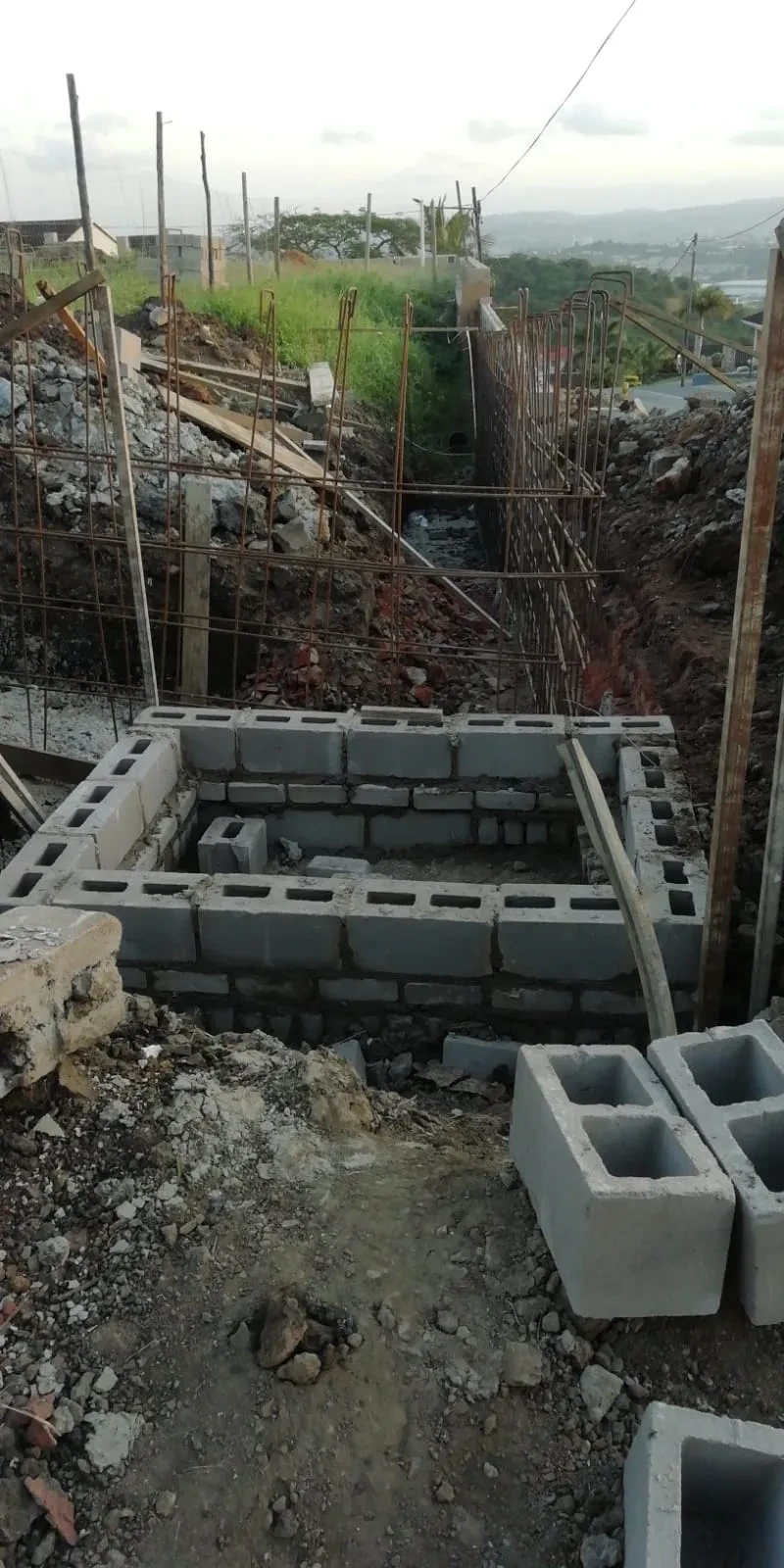 Project site — foundation work with concrete blocks and rebar