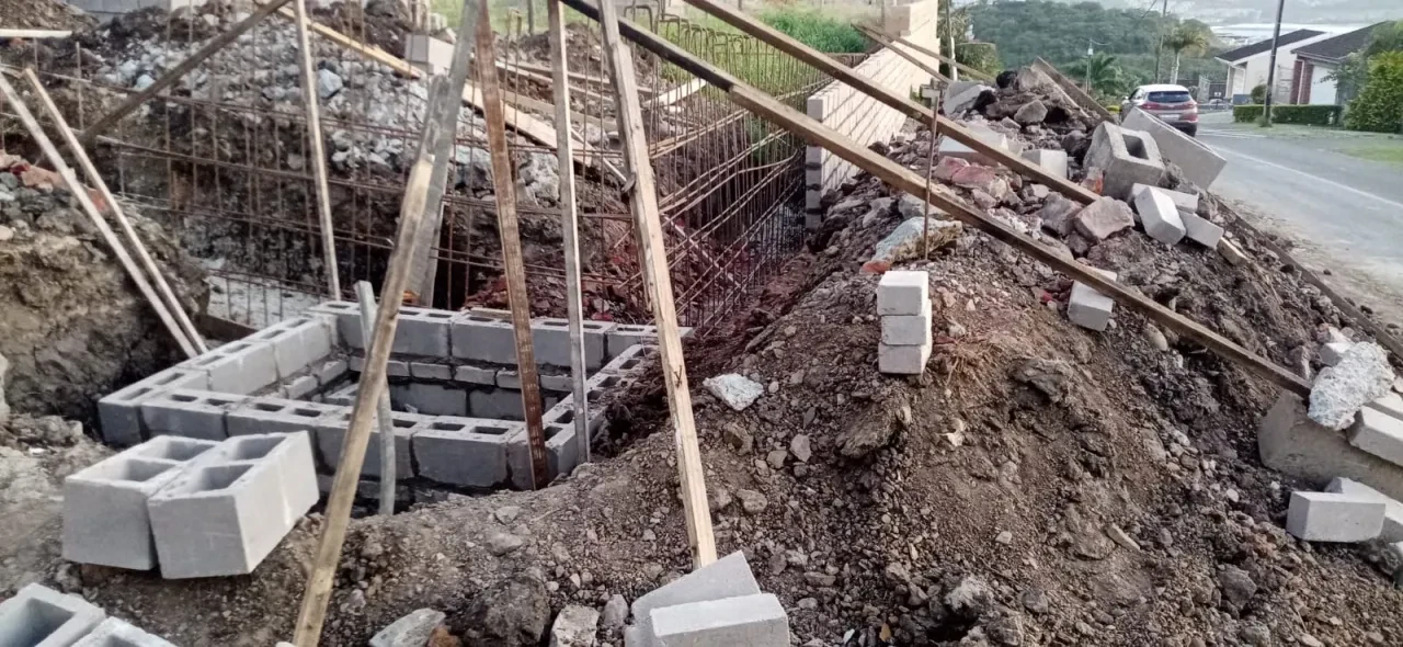 Project site — foundation work with concrete blocks, rebar and earthwork