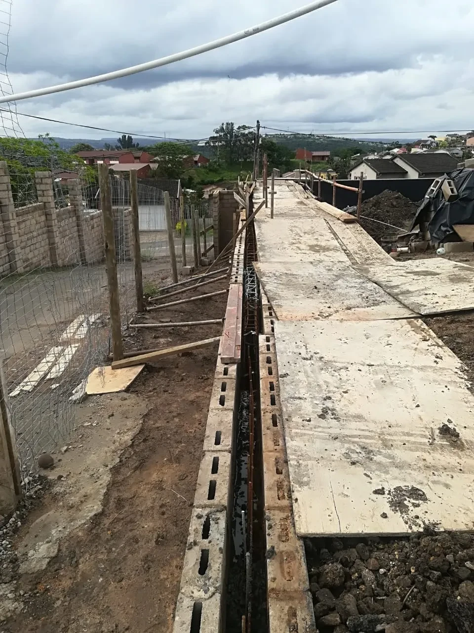Project site — residential construction at dusk