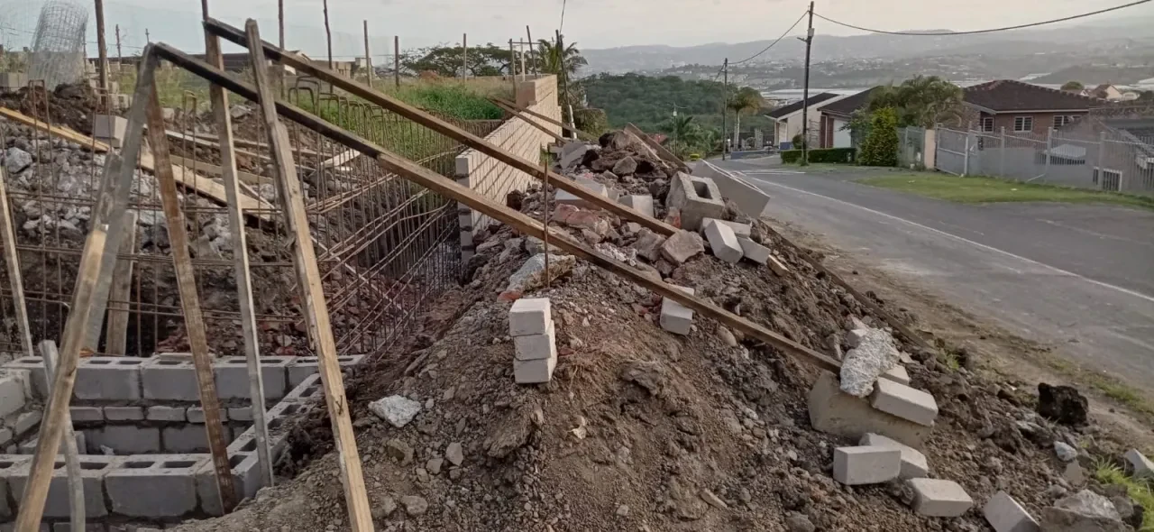 Project site — foundation retaining walls and hillside residential setting