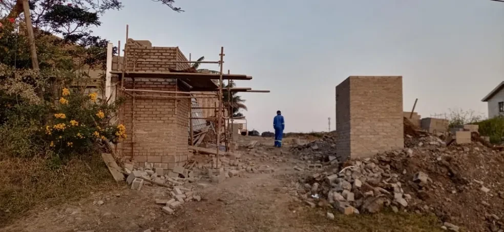 Project site — brick structure with scaffolding under construction