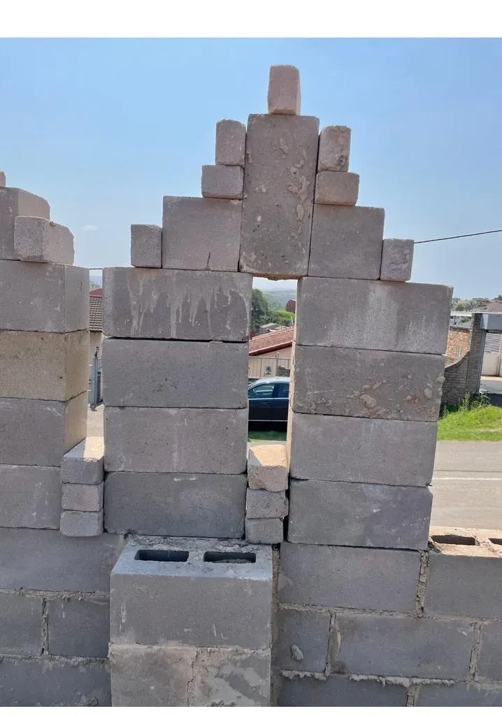 Project site — concrete block wall close-up showing arch opening