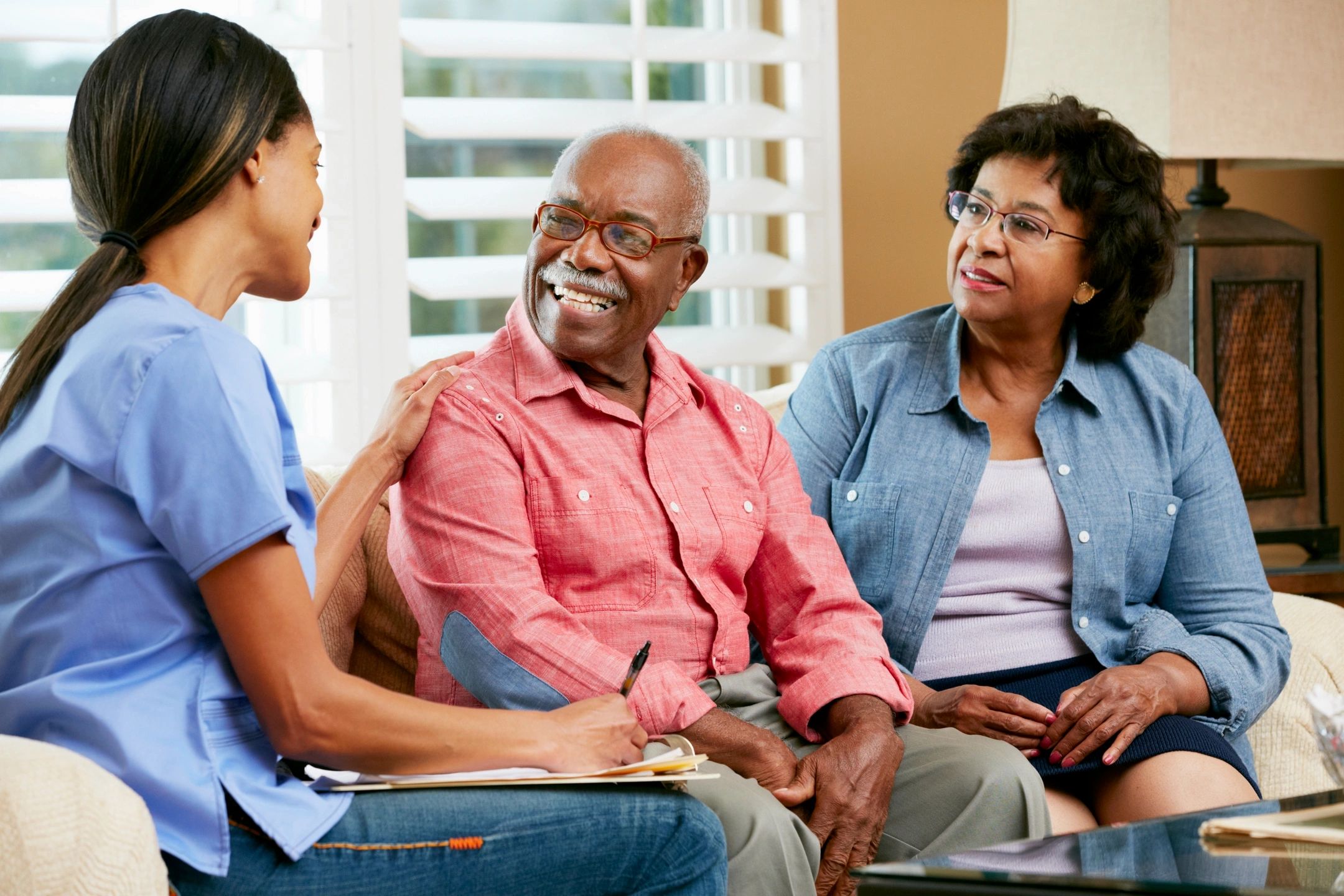 Caregiver speaking with senior residents